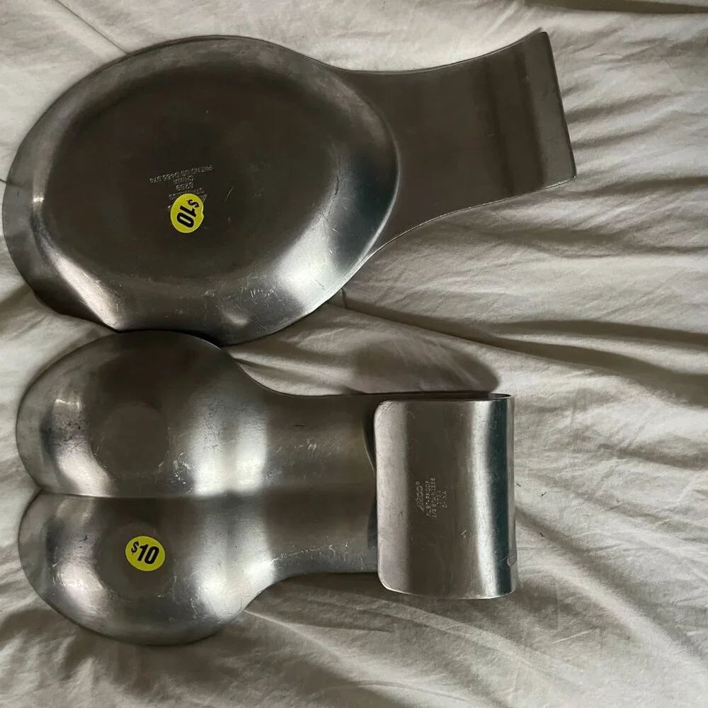 two stainless steel spoon rests